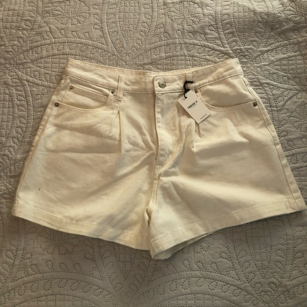 White pleat front jean shorts